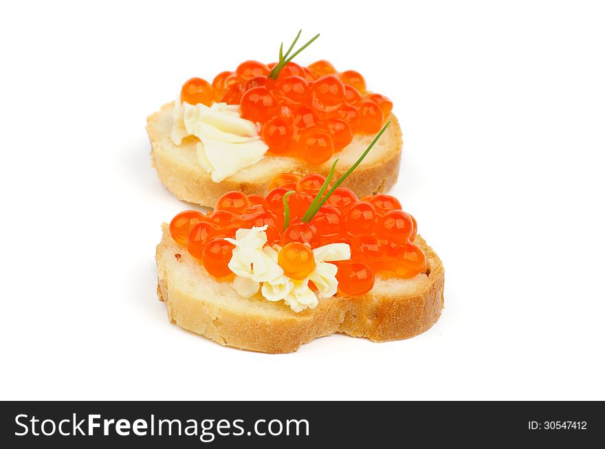 Two Delicious Red Caviar Snacks with Butter, Spring Onion and Baguette isolated on white background