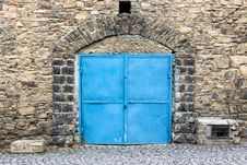 Stone Wall With Blue Door Stock Photos