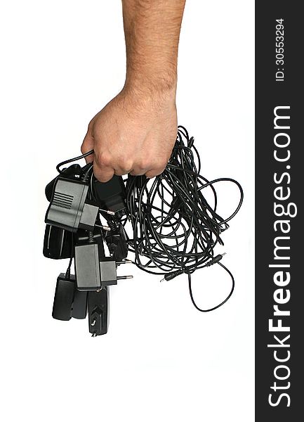 Many mobile chargers are held in the hand on a white background