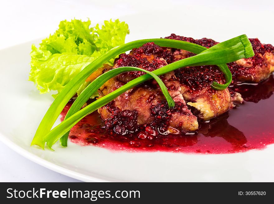 Meat in a raspberry sauce