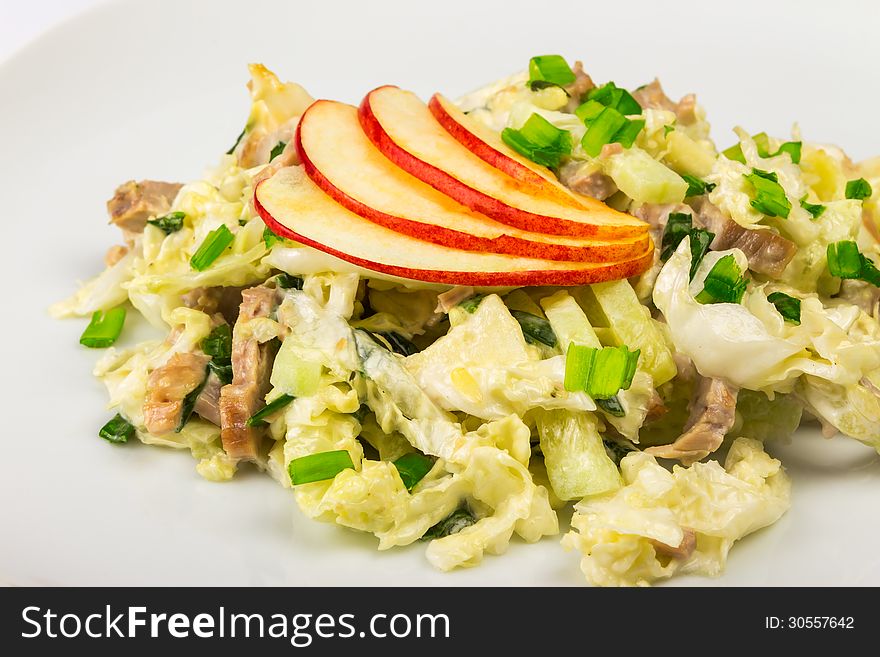 Meat salad with cabbage, cucumbers and apples. Meat salad with cabbage, cucumbers and apples