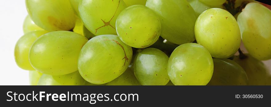 Bunch of grapes on a light background (details)