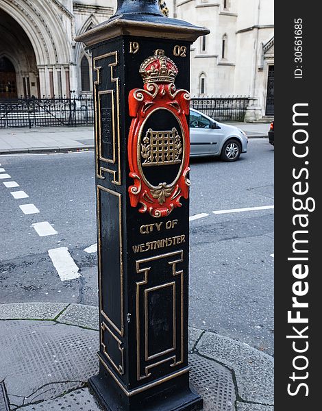Old post showing the area of the city Westminster and coat of arms, London, UK. Old post showing the area of the city Westminster and coat of arms, London, UK