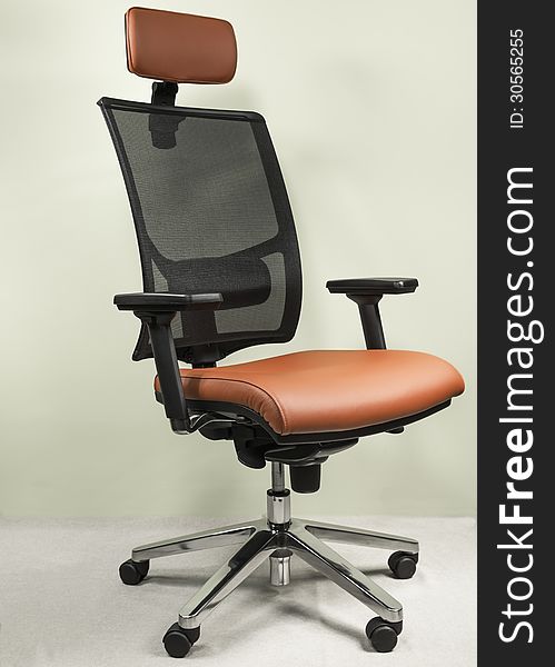 High-end office chair covered with red leather. High-end office chair covered with red leather