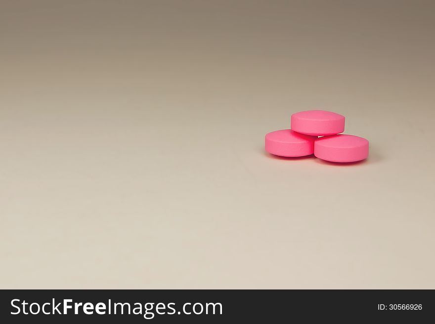 Purple pills on a neutral background. Purple pills on a neutral background