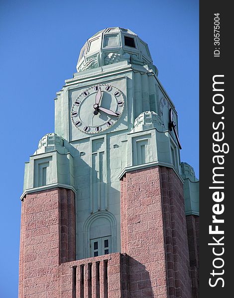 Color photo of clock tower at railway station in Helsinki