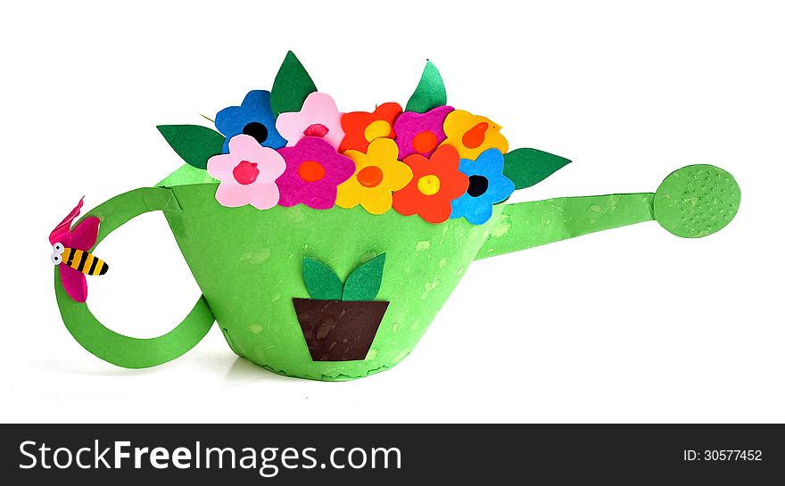 A watering pot made by a young child using colored card boards. A watering pot made by a young child using colored card boards