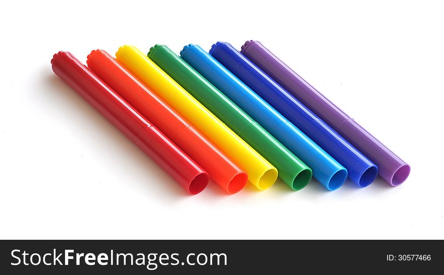 Seven coloring markers from red to violet