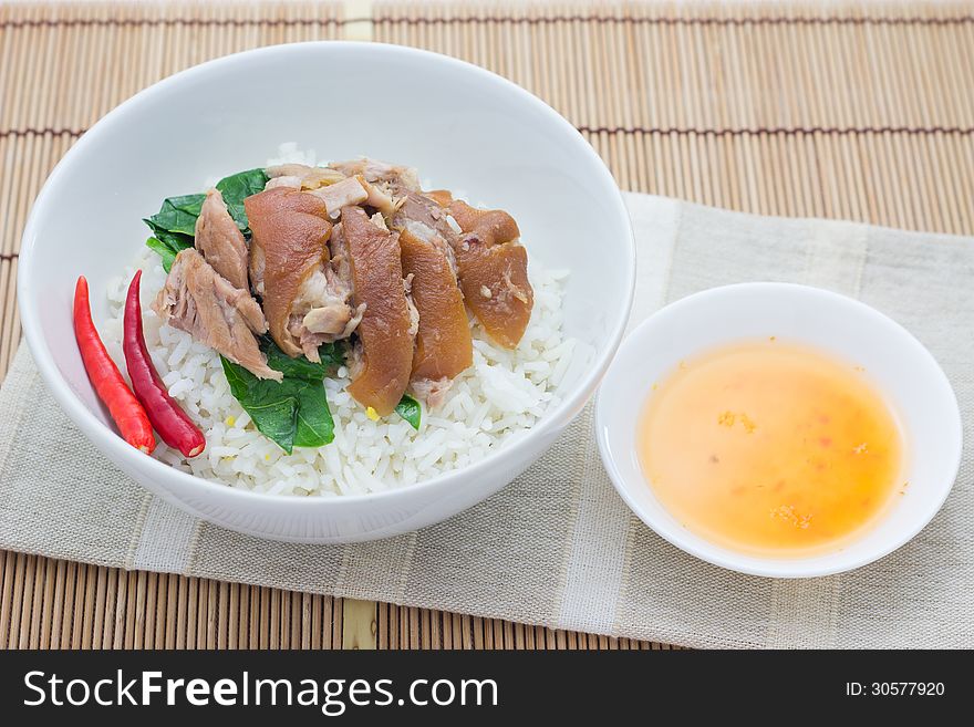 Braised Pork with Mei Gan Cai on plain rice. Thai style