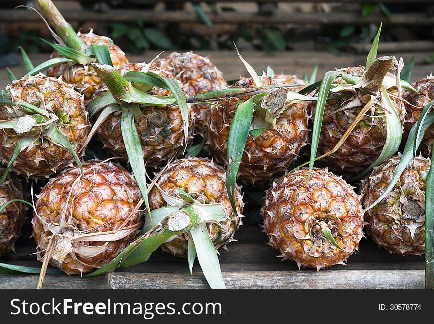 Pile Of Pineapples For Sale In Local Market