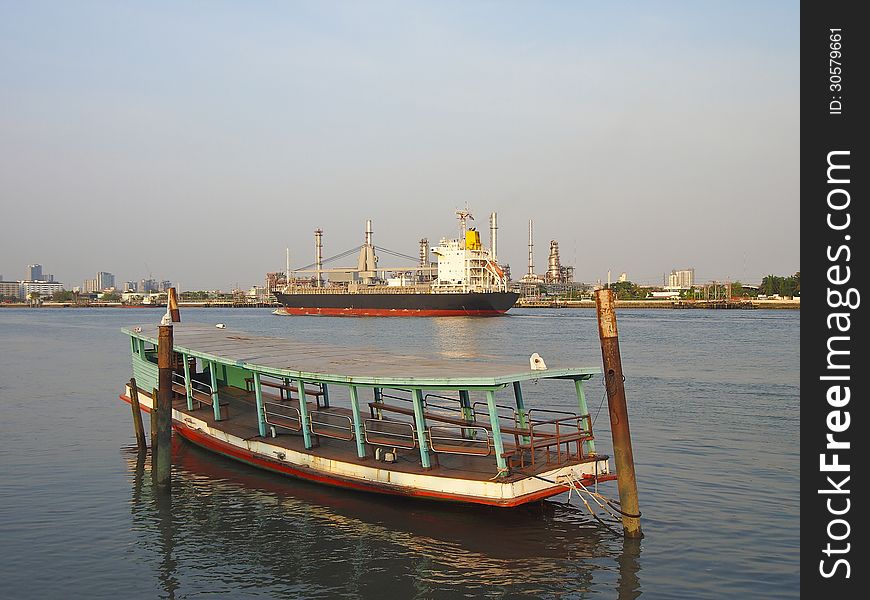 Small ferry boat and ship in Chao Phraya river Bangkok Thailand