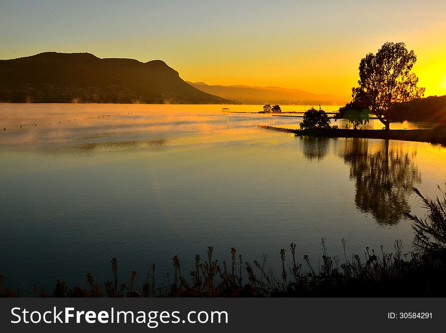 First light at Hartebeesport Dam Gauteng South Africa rising mist creates strange shapes. First light at Hartebeesport Dam Gauteng South Africa rising mist creates strange shapes