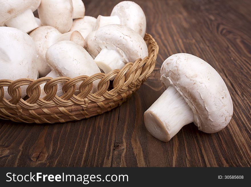 Mushrooms on a wooden background close-up