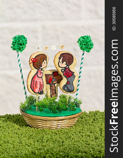 Cookies decorated with a romantic couple in front of a mailbox. Cookies decorated with a romantic couple in front of a mailbox
