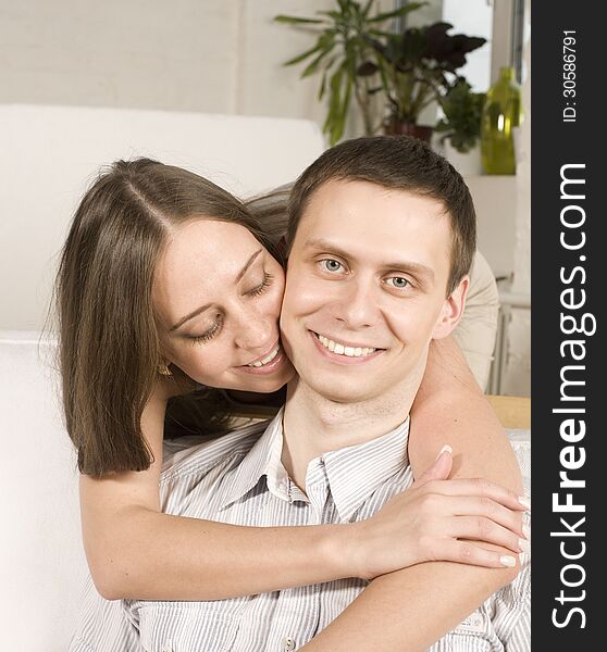 Close Up Portrait Of Pretty Young Couple. Man And Woman Hugging