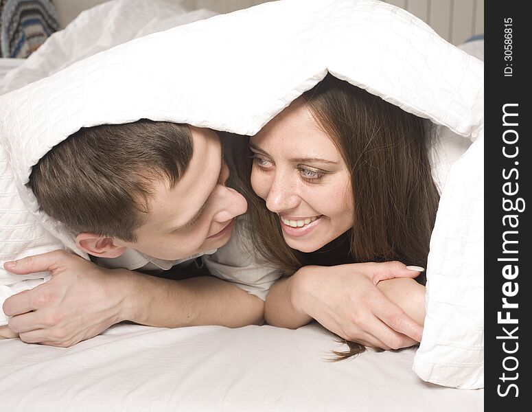 Close Up Portrait Of Pretty Young Couple. Man And Woman Hugging