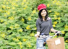 Portrait Of An Happy Smiling Girl Riding A Bicycle In The Park. Royalty Free Stock Photo Portrait Of An Happy Smiling Girl Riding A Bicycle In The Park. Royalty Free Stock Photo