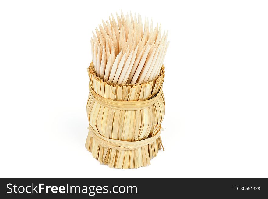 Bunch of Toothpicks in Wicker Basket isolated on white background