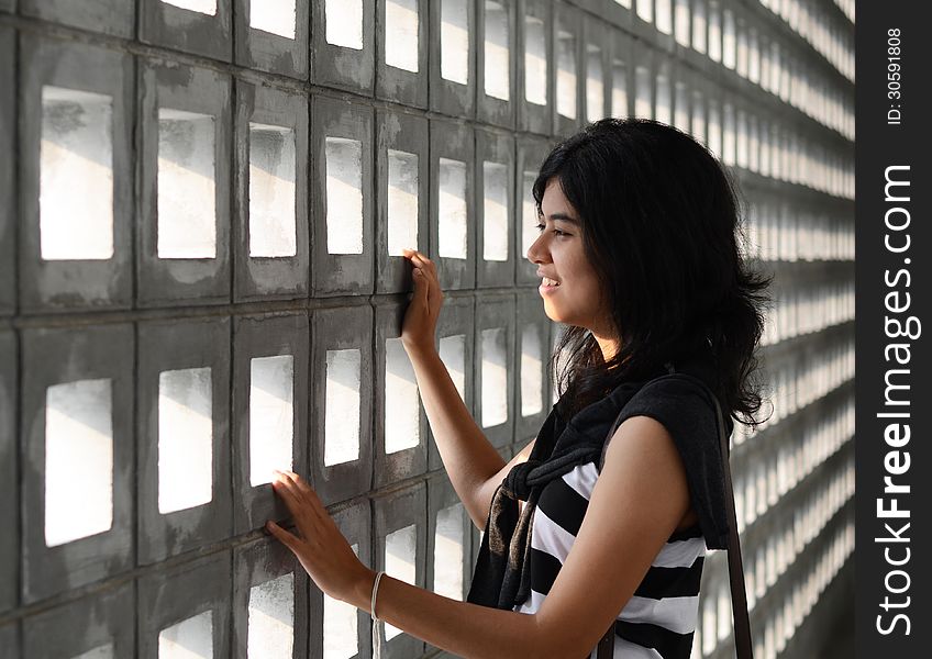 Woman With A Sad Expression On A Dramatic Background