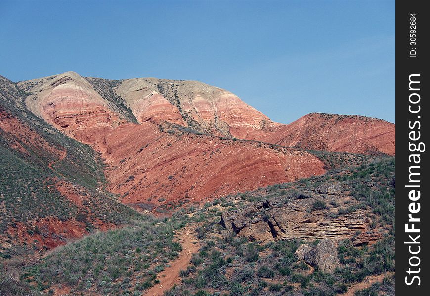 Big Bogda Mountain in the Astrakhan steppes, red hill in the desert