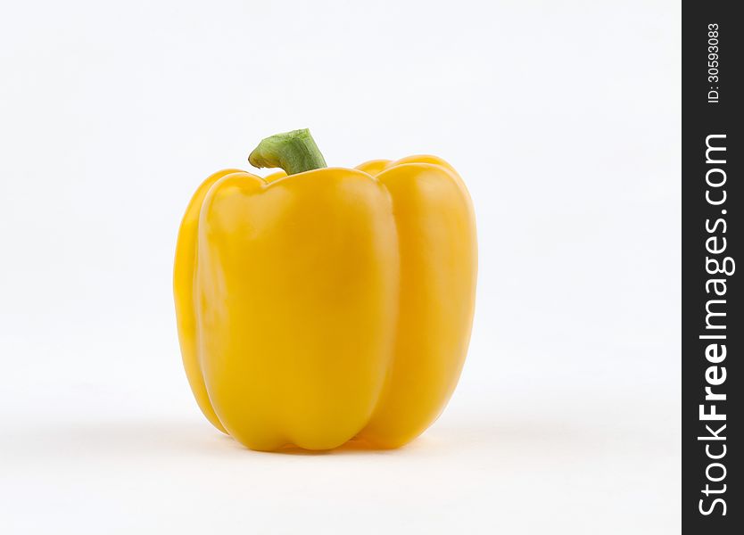 Colorful yellow sweet pepper great for cooking and salad the image on white. Colorful yellow sweet pepper great for cooking and salad the image on white