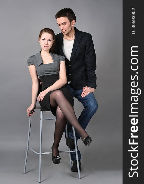 Portrait of young caucasian couple on gray background. Portrait of young caucasian couple on gray background