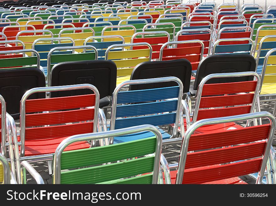 Color chairs in rows waiting for visitors