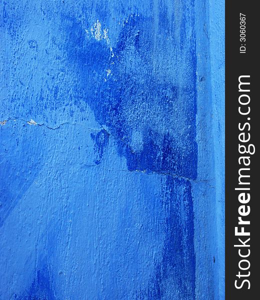 Old blue wall with dark bruises