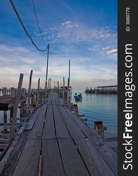 A lonely jetty with blue skies at twilight. A lonely jetty with blue skies at twilight