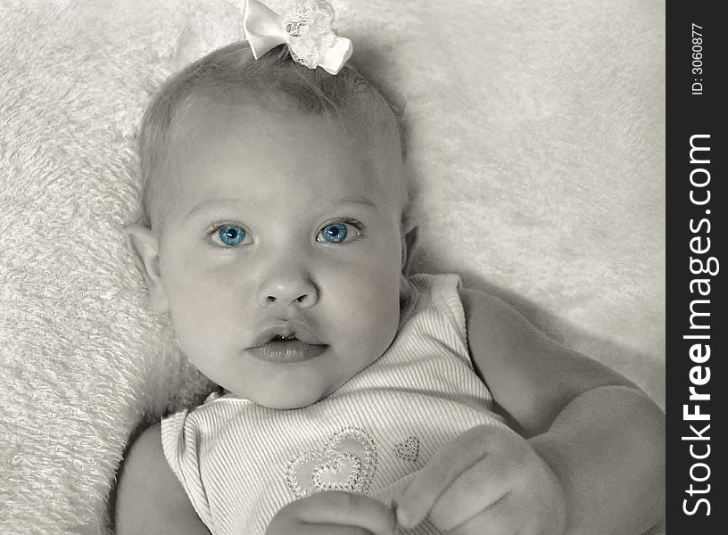 Portrait of a baby girl ... selective coloring on the blue eyes.