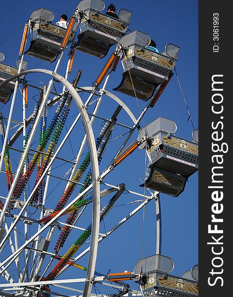 Ferris wheel with people on it at the local fair