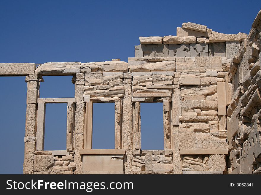 Windows in an ancient stone wall at the Parthenon in Athens Greece. Windows in an ancient stone wall at the Parthenon in Athens Greece