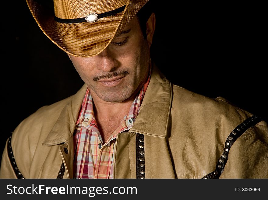 Portrait of a cowboy wearing cowboy hat. Portrait of a cowboy wearing cowboy hat