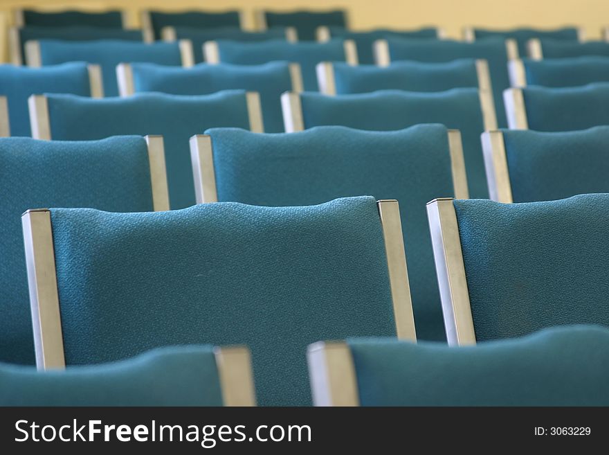 Selective focus image of rows of empty chair acks. Selective focus image of rows of empty chair acks.