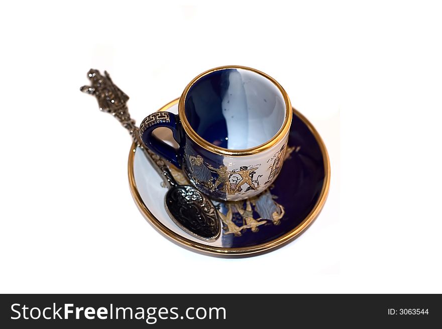Empty tea cup with spoon and saucer. Empty tea cup with spoon and saucer