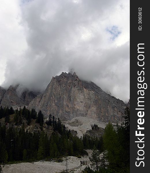 A view of Dolomitic mountains in Italy with clouds