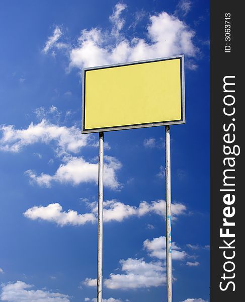 Blank sign with space for you text against deep blue sky. Blank sign with space for you text against deep blue sky