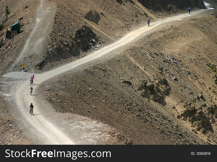 Five riders at the start of an extreme sport mountain bike race. Five riders at the start of an extreme sport mountain bike race