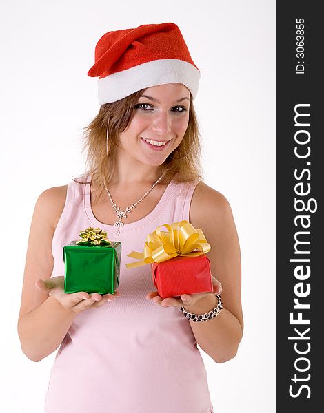 Girl wearing a santa hat and holding a gift box. Girl wearing a santa hat and holding a gift box