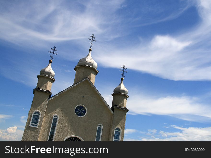 Skewed perspective of church against blue sky. Skewed perspective of church against blue sky.