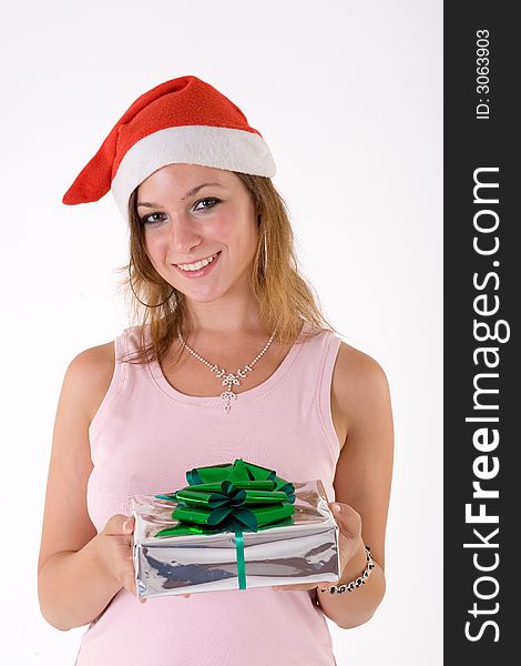 Girl wearing a santa hat and holding a gift box. Girl wearing a santa hat and holding a gift box