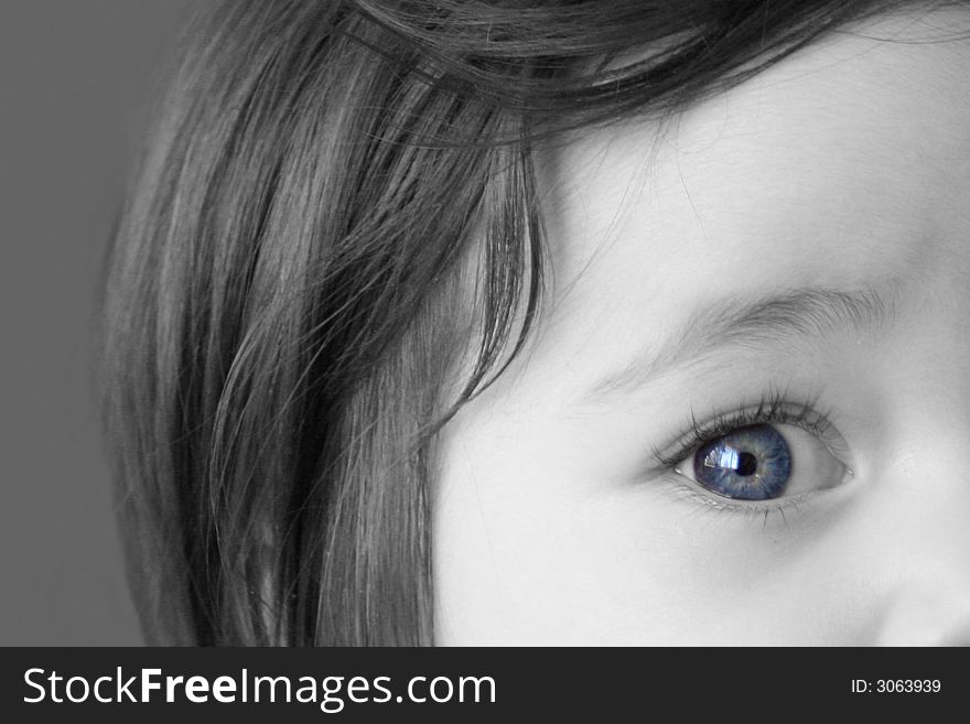 Black and White close up portrait of a young girl with digitally enhanced blue eye. Black and White close up portrait of a young girl with digitally enhanced blue eye.