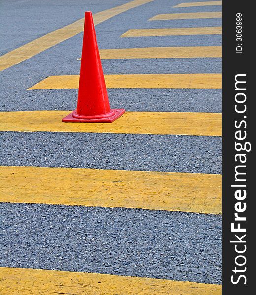 Red traffic Cone on the road.