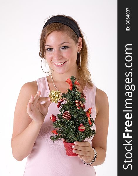 Girl with christmas tree and a gold star
