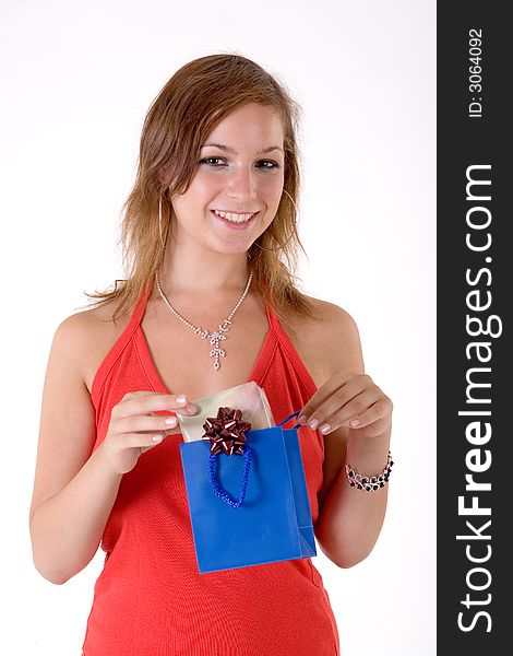 Girl wearing a santa hat and holding a gift box. Girl wearing a santa hat and holding a gift box