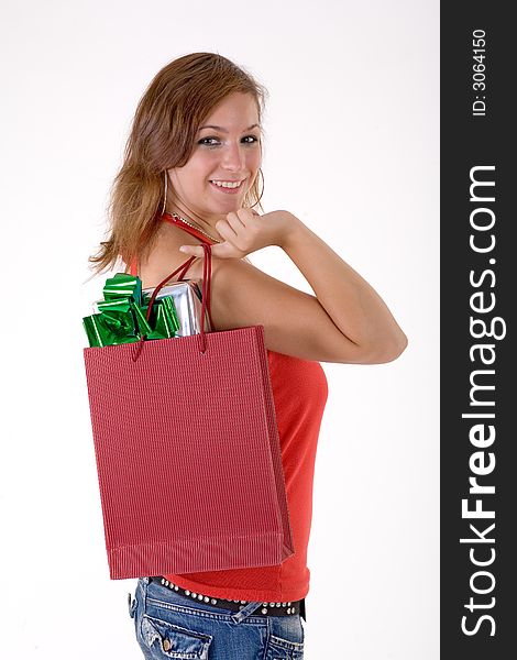 Girl wearing a santa hat and holding a gift box. Girl wearing a santa hat and holding a gift box