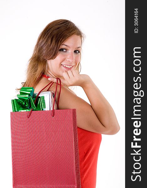 Girl wearing a santa hat and holding a gift box. Girl wearing a santa hat and holding a gift box