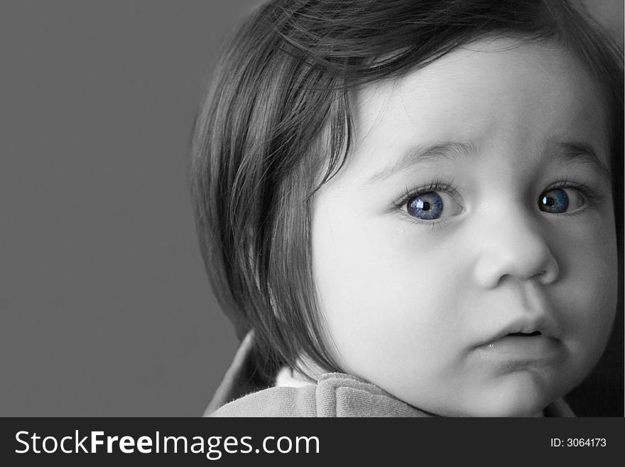 Black and White portrait of a young girl with digitally enhanced blue eyes. Black and White portrait of a young girl with digitally enhanced blue eyes.