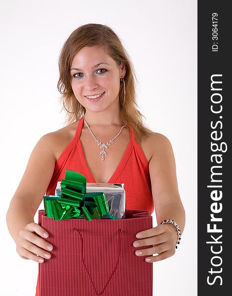 Girl wearing a santa hat and holding a gift box. Girl wearing a santa hat and holding a gift box