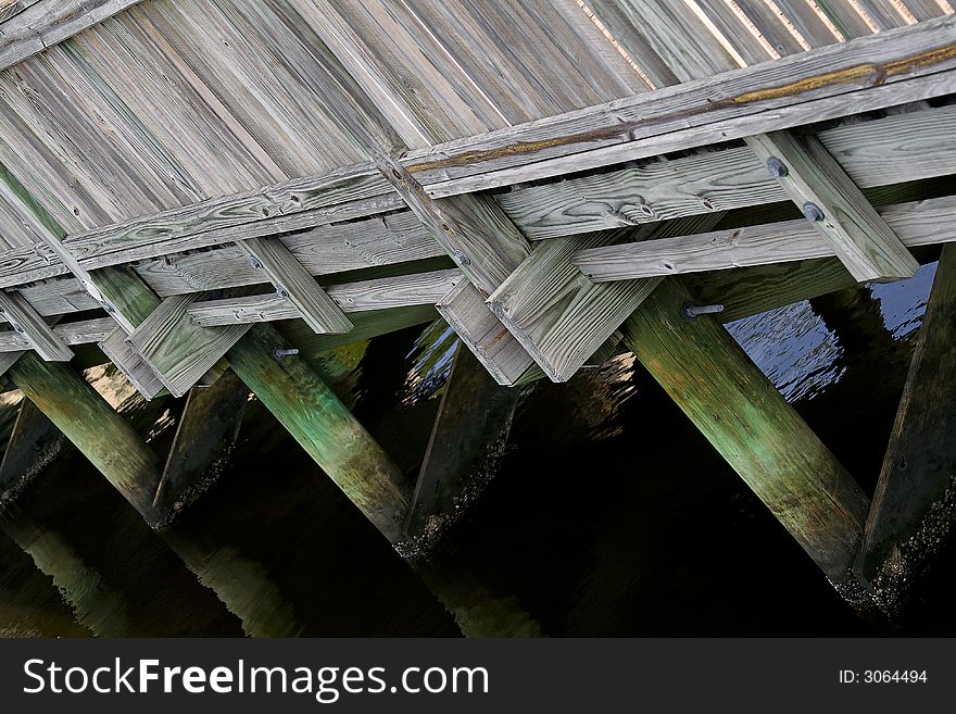 Wooden bridge at angle with barnacles